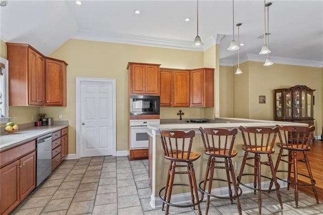 kitchen with white oven, light countertops, a kitchen bar, black microwave, and stainless steel dishwasher