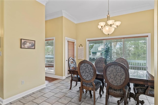 dining area with a chandelier, a healthy amount of sunlight, and crown molding