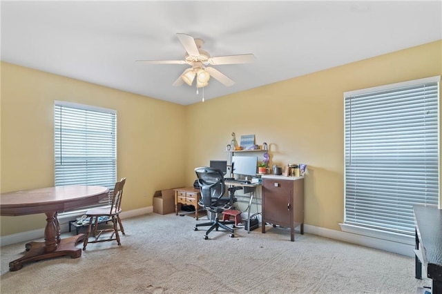 office featuring carpet floors, ceiling fan, and baseboards