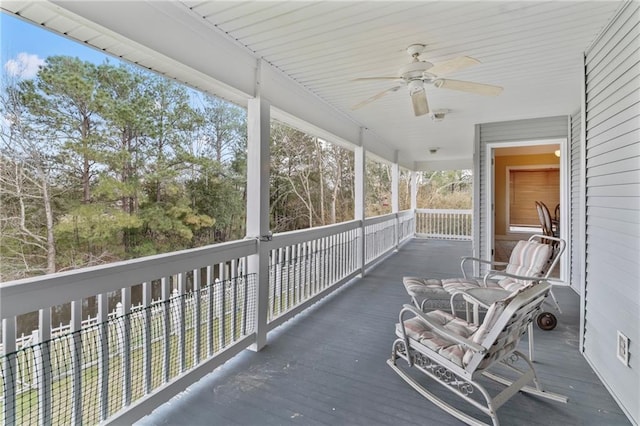 exterior space featuring ceiling fan