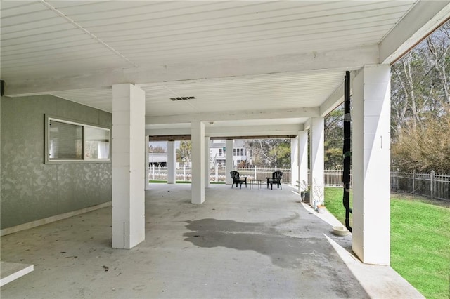 view of patio / terrace featuring visible vents and fence