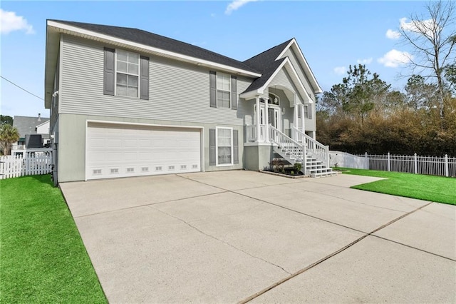 view of front facade featuring a garage, concrete driveway, a front yard, and fence