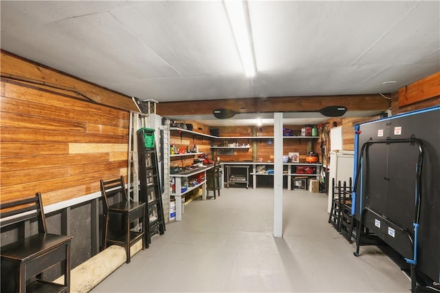 finished basement featuring wooden walls