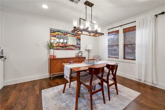 132 Coventry Ct, River Ridge, LA 70123 - dining room featuring crown molding, wood finished floors, an inviting chandelier, and baseboards