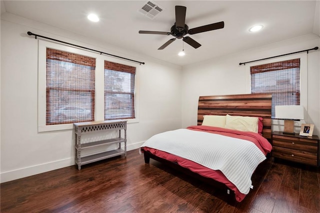 bedroom featuring baseboards, visible vents, wood finished floors, and recessed lighting