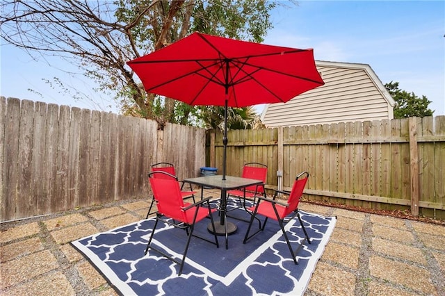 132 Coventry Ct, River Ridge, LA 70123 - view of patio featuring a fenced backyard and outdoor dining area