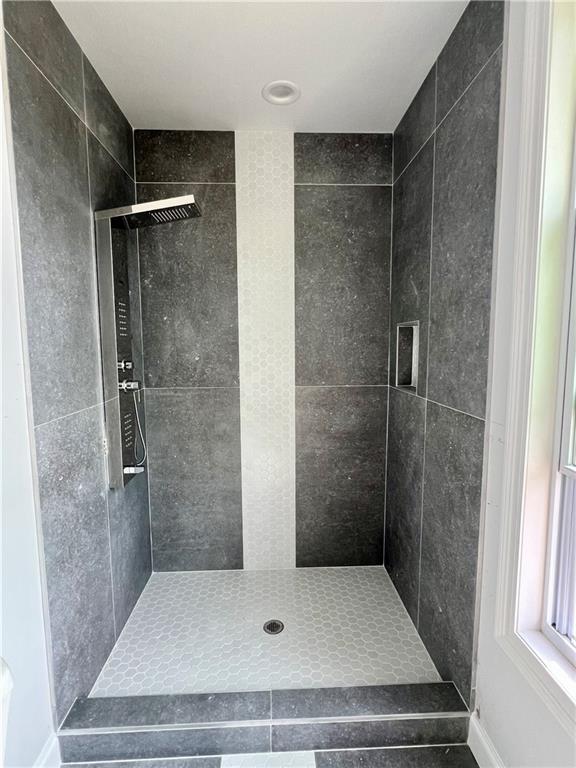 bathroom featuring a stall shower