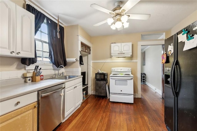 kitchen with a sink, electric stove, stainless steel dishwasher, black fridge, and dark wood-style floors