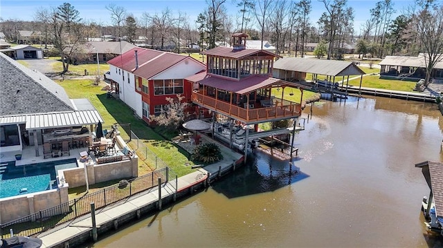 birds eye view of property featuring a water view and a residential view