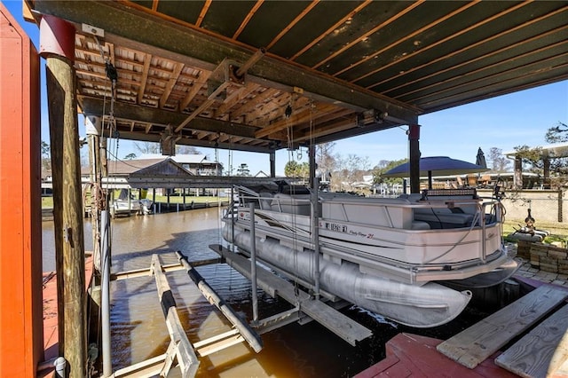 view of dock featuring a water view and boat lift