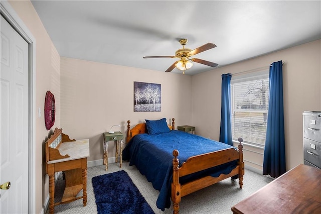 bedroom featuring carpet, a ceiling fan, and baseboards