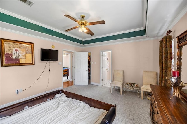 bedroom featuring carpet floors, crown molding, visible vents, a ceiling fan, and baseboards