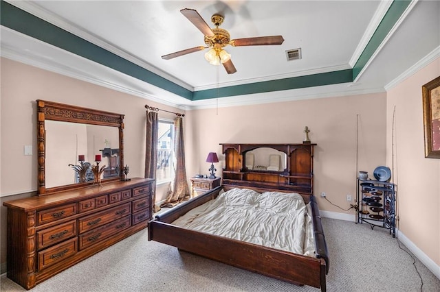 bedroom with a raised ceiling, ornamental molding, carpet flooring, and visible vents