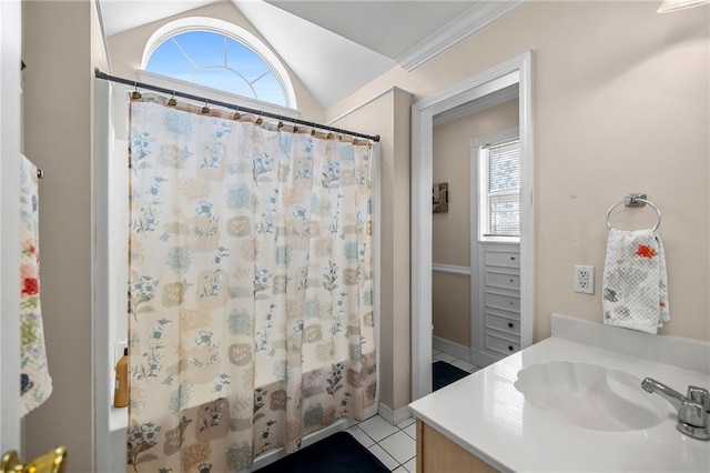 bathroom featuring lofted ceiling, curtained shower, tile patterned flooring, and vanity