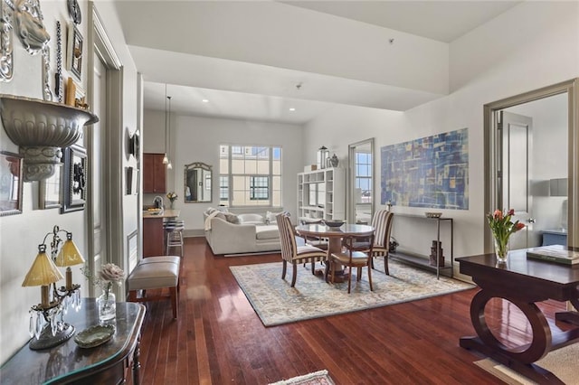 dining area featuring dark wood-style floors and recessed lighting