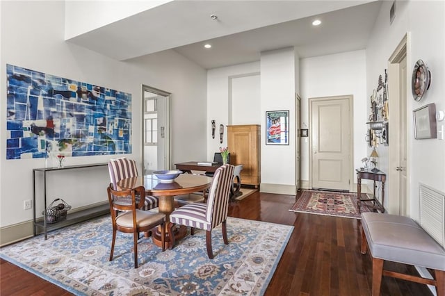 dining space with recessed lighting, baseboards, and hardwood / wood-style flooring