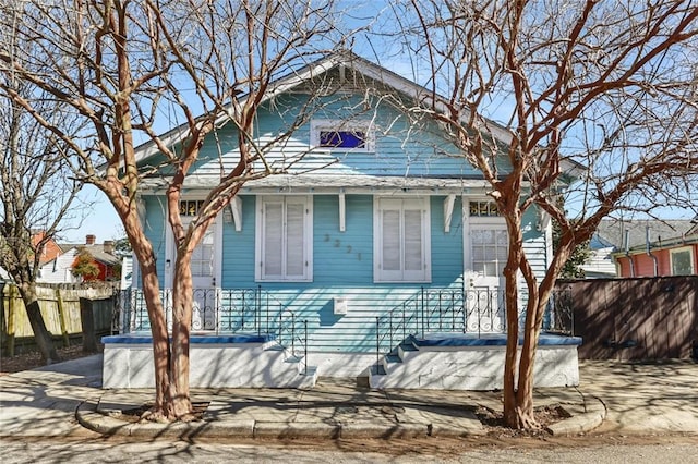 view of home's exterior with fence