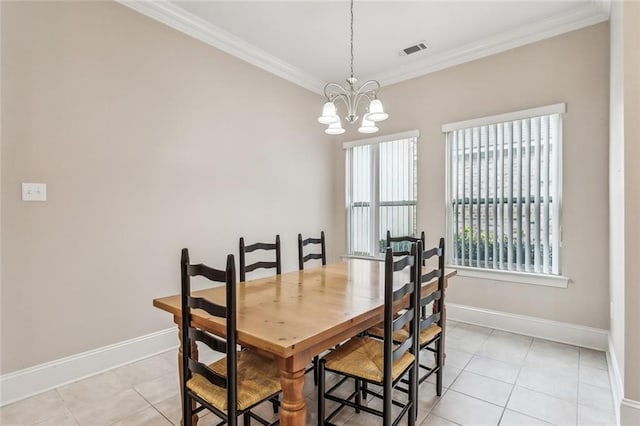 dining room featuring a chandelier, ornamental molding, light tile patterned flooring, and visible vents