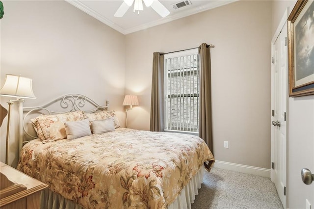 bedroom with carpet floors, a ceiling fan, visible vents, baseboards, and ornamental molding