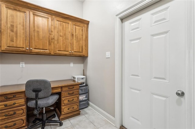 office space featuring light tile patterned floors and baseboards