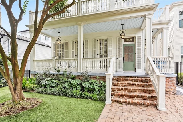 entrance to property featuring a porch