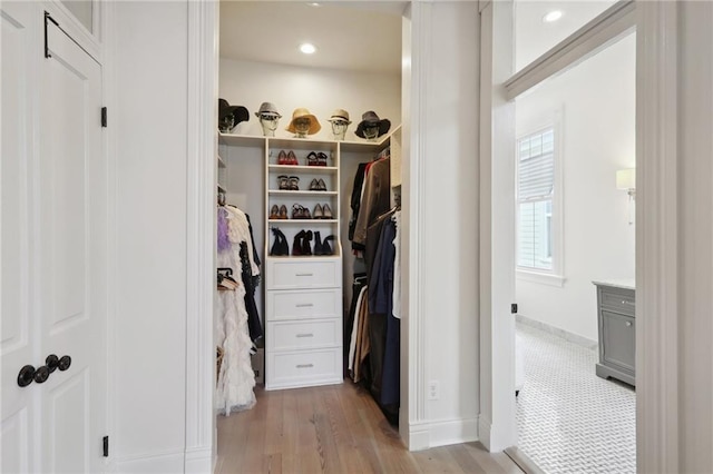 walk in closet featuring light wood-style floors