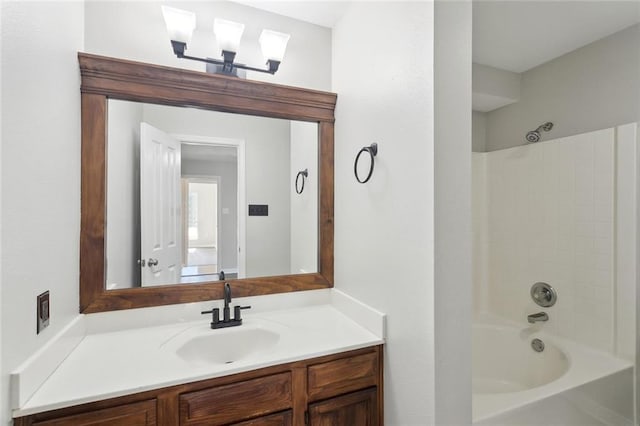 bathroom featuring tub / shower combination and vanity