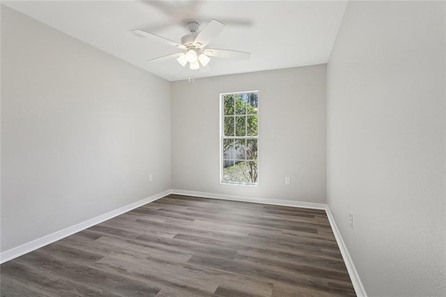 unfurnished room with a ceiling fan, baseboards, and wood finished floors