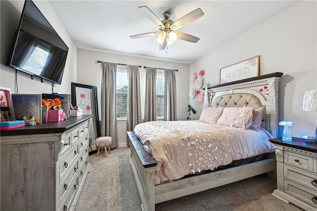 bedroom with ceiling fan and light colored carpet