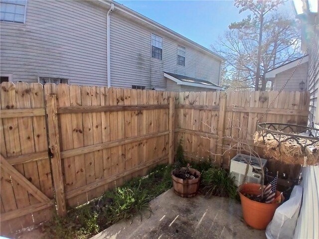 view of patio / terrace featuring fence