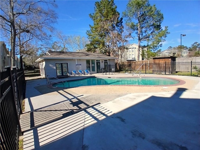 view of pool with fence, a fenced in pool, and a patio