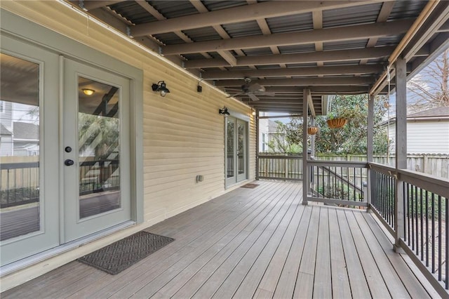 wooden terrace with french doors and fence