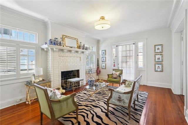 living room featuring a healthy amount of sunlight, ornamental molding, and wood finished floors