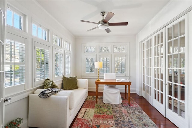 sunroom with a ceiling fan