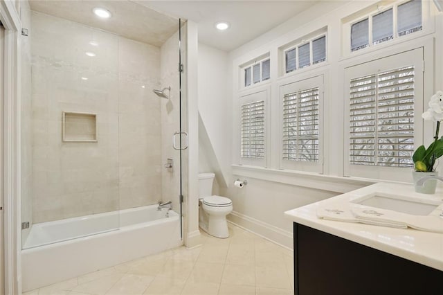 bathroom featuring baseboards, toilet, tile patterned floors, vanity, and recessed lighting