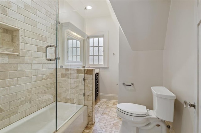 bathroom featuring toilet, baseboards, and vanity