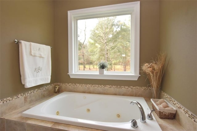 full bathroom featuring a tub with jets