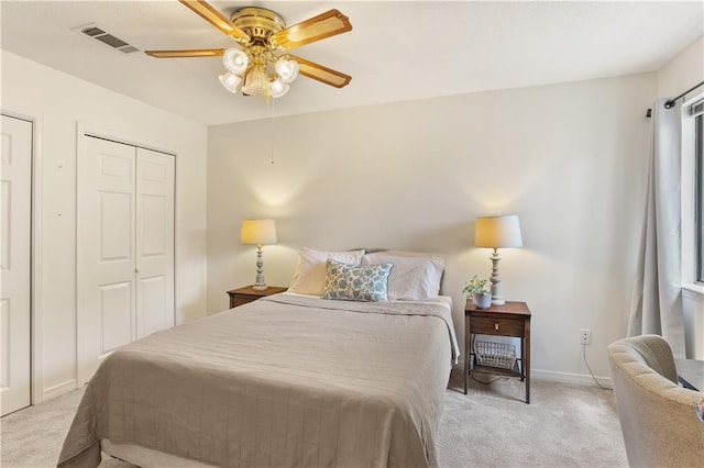 bedroom featuring light carpet, baseboards, visible vents, and ceiling fan