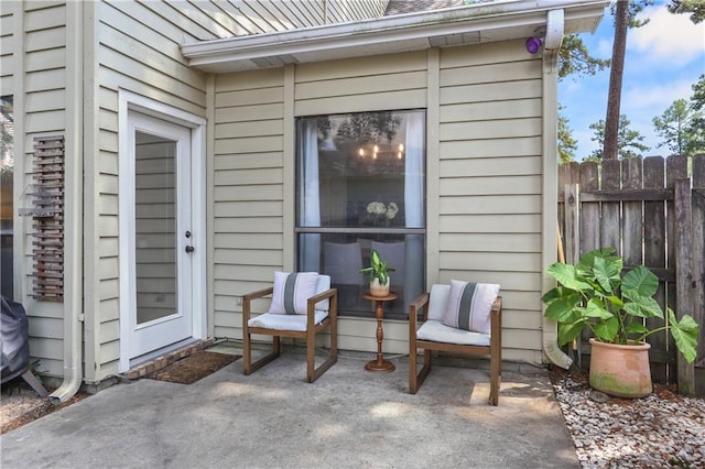 view of patio / terrace featuring fence