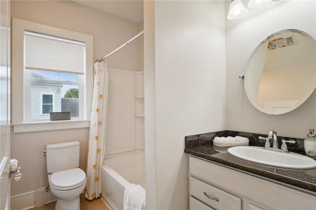 bathroom featuring toilet, shower / bath combination with curtain, and vanity