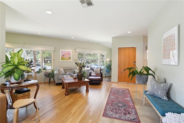 living area featuring light wood-type flooring, visible vents, plenty of natural light, and recessed lighting