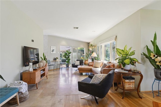 living room with light wood-type flooring and visible vents