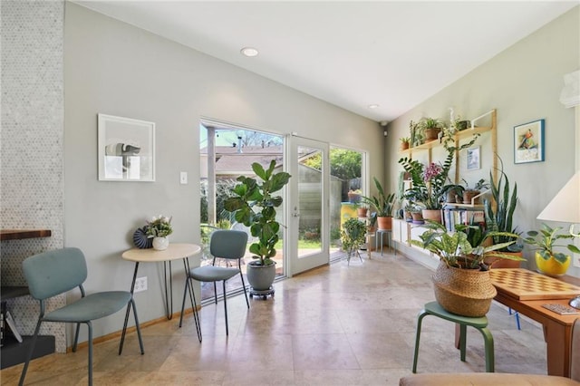 sitting room featuring tile patterned flooring and baseboards