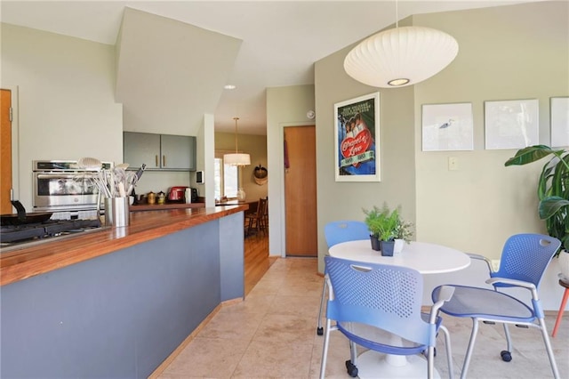 dining area featuring light tile patterned floors