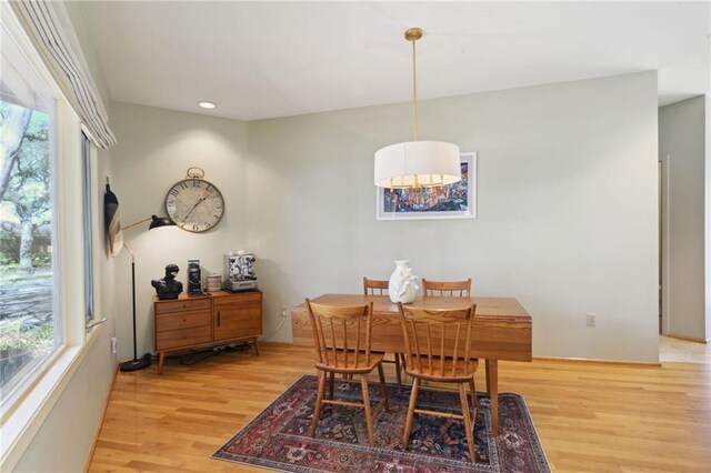 dining area featuring light wood-style flooring and recessed lighting