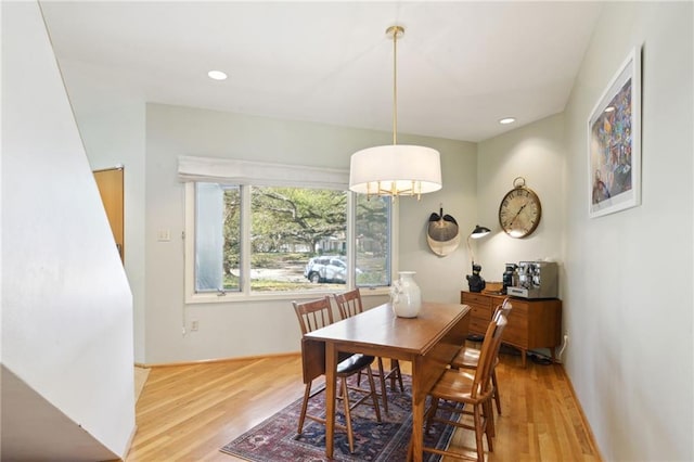 dining space featuring light wood-style flooring and recessed lighting