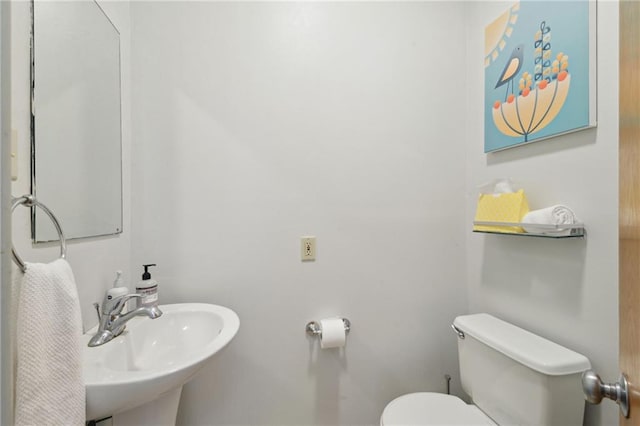 bathroom featuring a sink and toilet