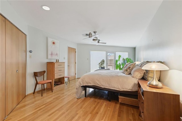 bedroom with light wood-style floors and ceiling fan