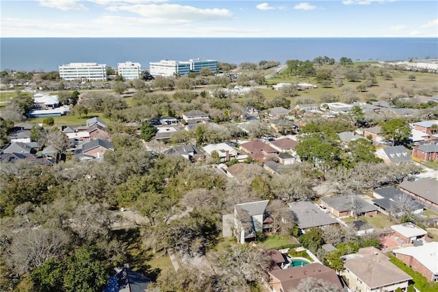 birds eye view of property with a water view and a residential view