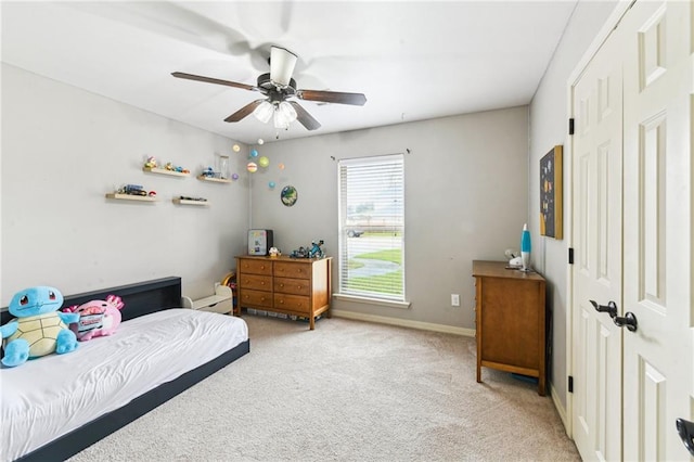 bedroom with carpet, baseboards, and ceiling fan